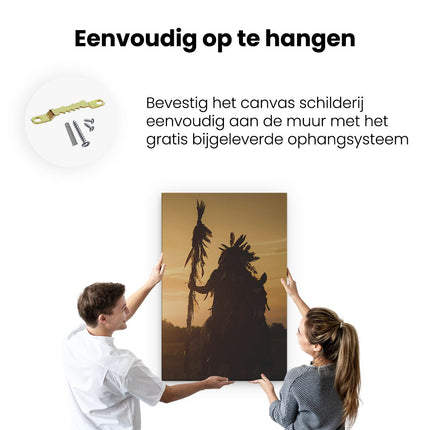 Canvas schilderij ophangen Indiaan met een Speer bij Zonsondergang