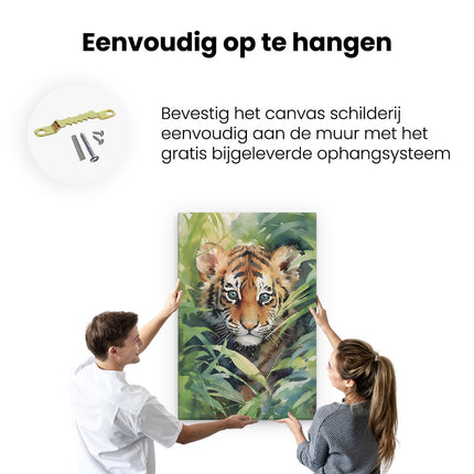 Canvas schilderij ophangen Baby Tijger tussen de Planten