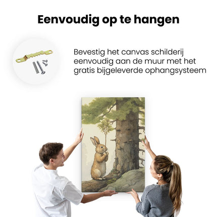 Canvas schilderij ophangen Konijn Knaagt bij een Boom