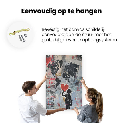 Canvas schilderij ophangen Jongen Houdt een Rood Hart voor een Wereldkaart