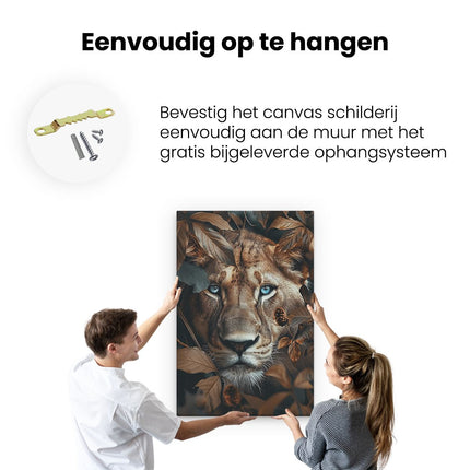 Canvas schilderij ophangen Leeuw met Blauwe Ogen in de Bladeren