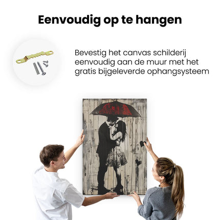 Canvas schilderij ophangen Paar Kussen onder een Paraplu