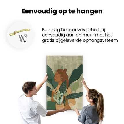 Canvas schilderij ophangen Vrouw die een Potplant Vasthoudt