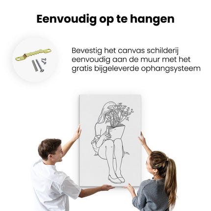 Canvas schilderij ophangen Meisje dat een Boek met Bloemen Leest