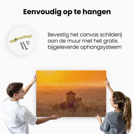 Canvas schilderij ophangen Leeuw En Leeuwin Tijdens Zonsondergang