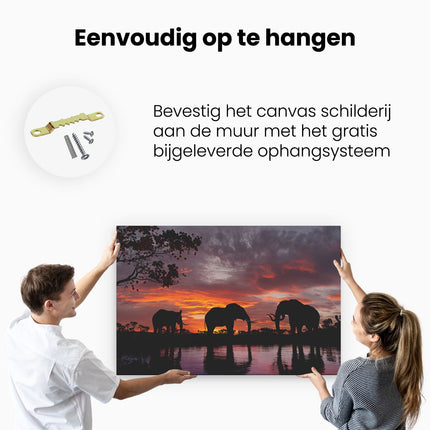 Canvas schilderij ophangen Olifanten Tijdens Zonsondergang - Silhouet