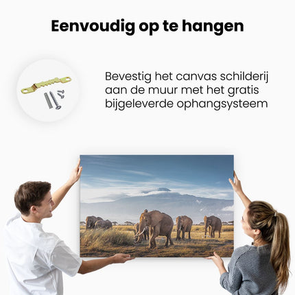 Canvas schilderij ophangen Groep Olifanten Lopen Voor De Bergen