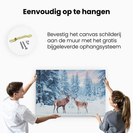 Canvas schilderij ophangen Twee Herten In Het Bos Met Sneeuw