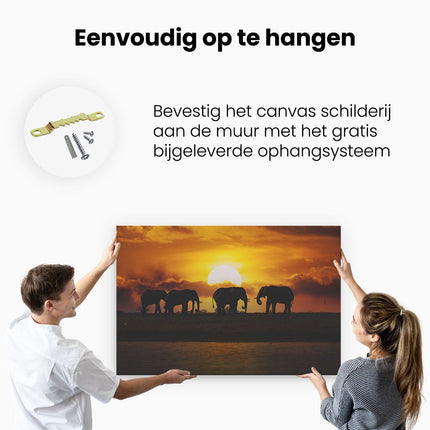 Canvas schilderij ophangen Silhouet Olifanten Tijdens Zonsondergang