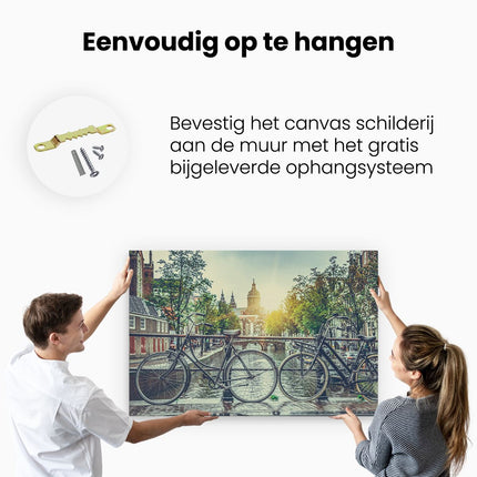 Canvas schilderij ophangen Amsterdamse Brug Bij Een Gracht Met Zonsondergang