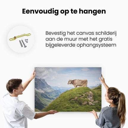 Canvas schilderij ophangen Koe In De Bergen