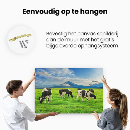 Canvas schilderij ophangen Koeien In De Wei