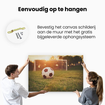 Canvas schilderij ophangen Voetbal Met Goal Tijdens Zonsondergang