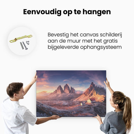 Canvas schilderij ophangen Huisje Met Een Kerk In De Bergen