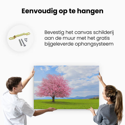 Canvas schilderij ophangen Roze Sakura Bloesem Boom In Het Groene Veld