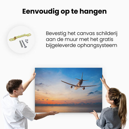 Canvas schilderij ophangen Vliegtuig Boven De Zee Bij Zonsondergang