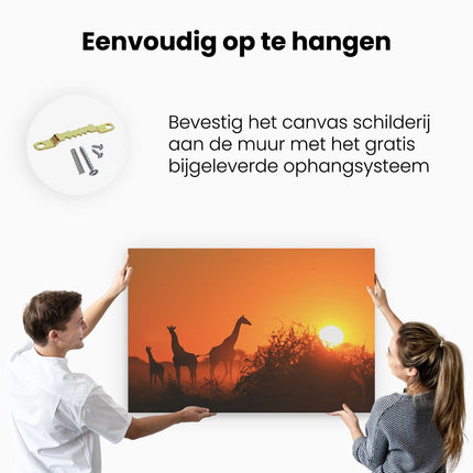 Canvas schilderij ophangen Drie Giraffe Silhouetten Bij Zonsondergang