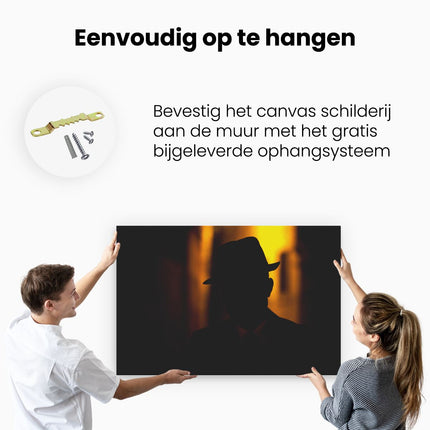 Canvas schilderij ophangen Silhouet Van Een Man Met Een Hoed