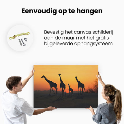 Canvas schilderij ophangen Vier Giraffe Silhouetten Bij Zonsondergang