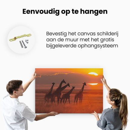 Canvas schilderij ophangen Giraffe Kudde Bij Zonsondergang