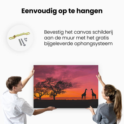 Canvas schilderij ophangen Twee Giraffe Silhouetten Bij Zonsondergang