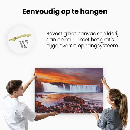 Canvas schilderij ophangen Waterval Bij Een Oranje Hemel