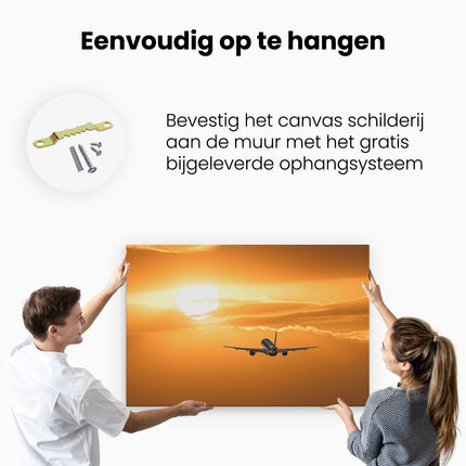 Canvas schilderij ophangen Vliegtuig Bij Zonsondergang