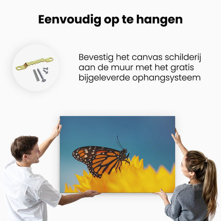 Canvas schilderij ophangen Oranje Vlinder Bij Een Zonnebloem