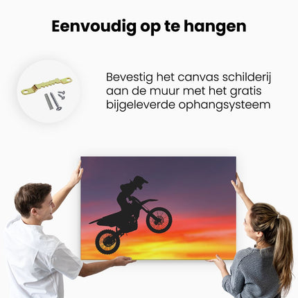 Canvas schilderij ophangen Silhouet Van Een Motorcross In De Lucht 
