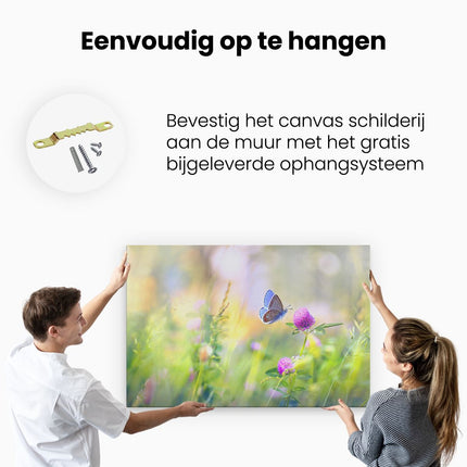 Canvas schilderij ophangen Blauwe Vlinder Bij Een Paarse Bloem