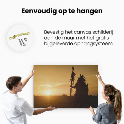 Canvas schilderij ophangen Indiaan met een Speer bij Zonsondergang