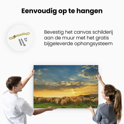 Canvas schilderij ophangen Kudde Schapen op het Gras bij Zonsondergang