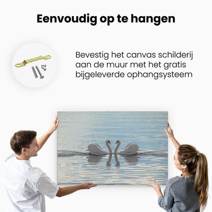 Canvas schilderij ophangen Zwanen Koppel op het Water