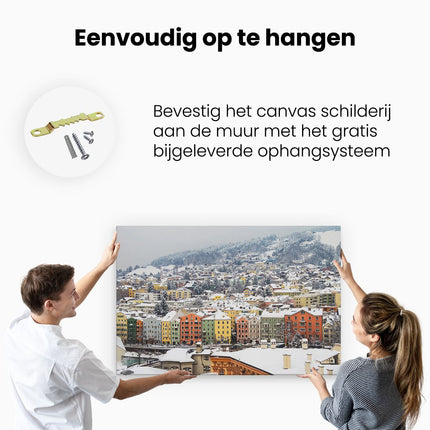 Canvas schilderij ophangen Gekleurde Huisjes met Sneeuw in Oostenrijk