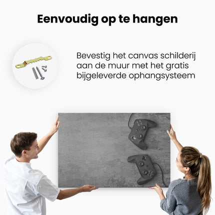 Canvas schilderij ophangen Twee Game Controllers op Tafel - Gaming