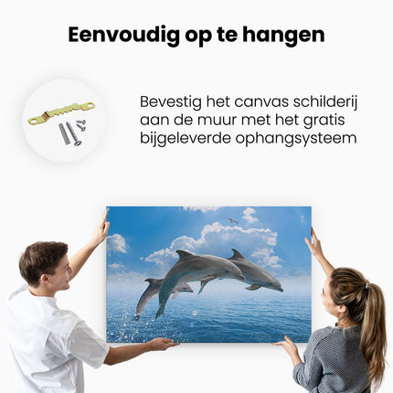 Canvas schilderij ophangen Dolfijnen Springen uit de Blauwe Zee