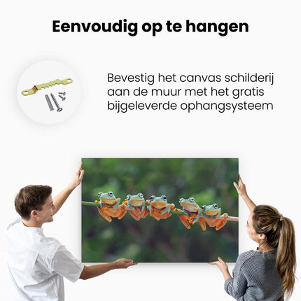 Canvas schilderij ophangen Groep Kikkers op een Tak