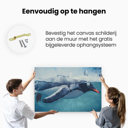 Canvas schilderij ophangen Pinguïn Zwemt in het Water