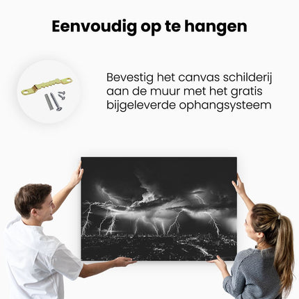 Canvas schilderij ophangen Blikseminslag op een Stad in het Paars - Zwart Wit