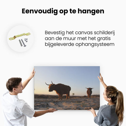 Canvas schilderij ophangen Twee Schotse Hooglanders op het Strand