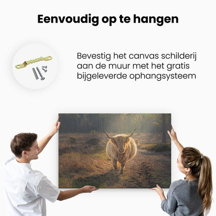 Canvas schilderij ophangen Schotse Hooglander in de Bossen 