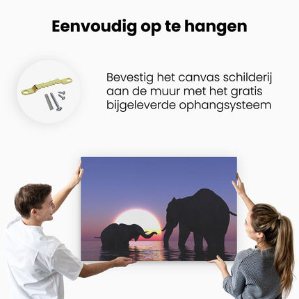 Canvas schilderij ophangen Twee Olifanten in het Water bij Zonsondergang