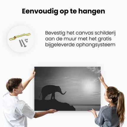 Canvas schilderij ophangen Olifant op een Rots aan de Zee bij Zonsondergang - Zwart Wit