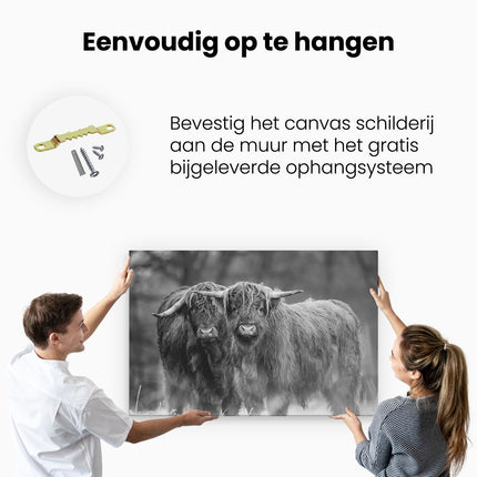 Canvas schilderij ophangen Twee Schotse Hooglanders in de Sneeuw - Zwart Wit