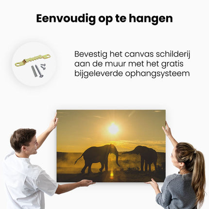 Canvas schilderij ophangen Twee Olifanten spelen tijdens Zonsondergang