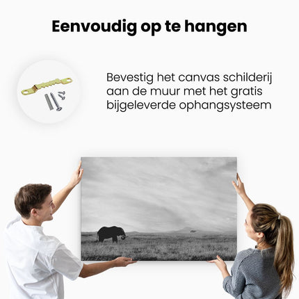 Canvas schilderij ophangen Olifant in het Savanne Veld - Zwart Wit