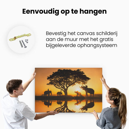 Canvas schilderij ophangen Olifanten Familie bij een Boom - Zonsondergang