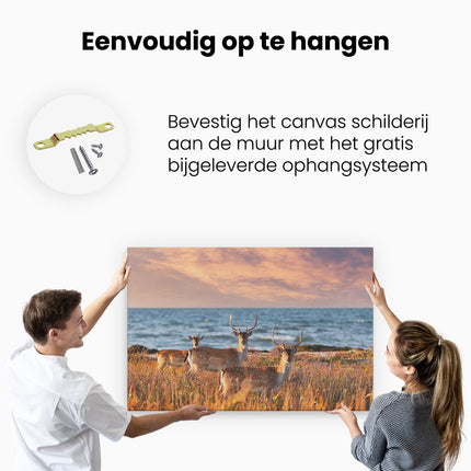 Canvas schilderij ophangen Drie Herten aan de Zee tijdens Zonsondergang