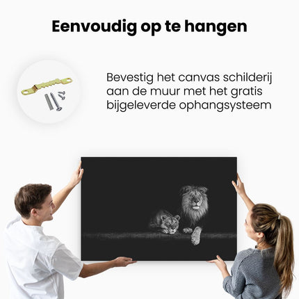 Canvas schilderij ophangen Leeuw en Leeuwin op een Boomstronk - Zwart Wit