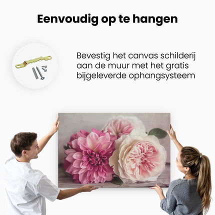 Canvas schilderij ophangen Drie Roze en Witte Bloemen op een Houten Tafel